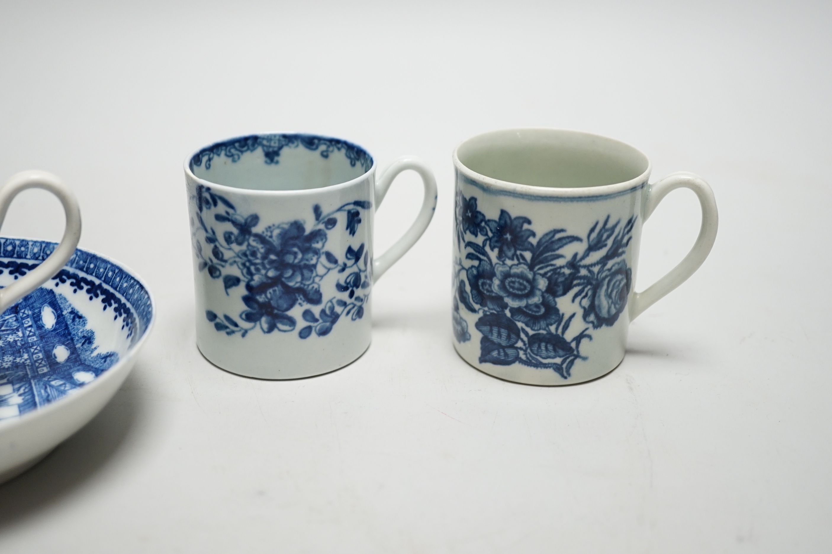 Two Worcester coffee cans, Mansfield and Three Flowers patterns, and a Worcester/Caughley coffee cup and saucer, Fisherman and Cormorant pattern